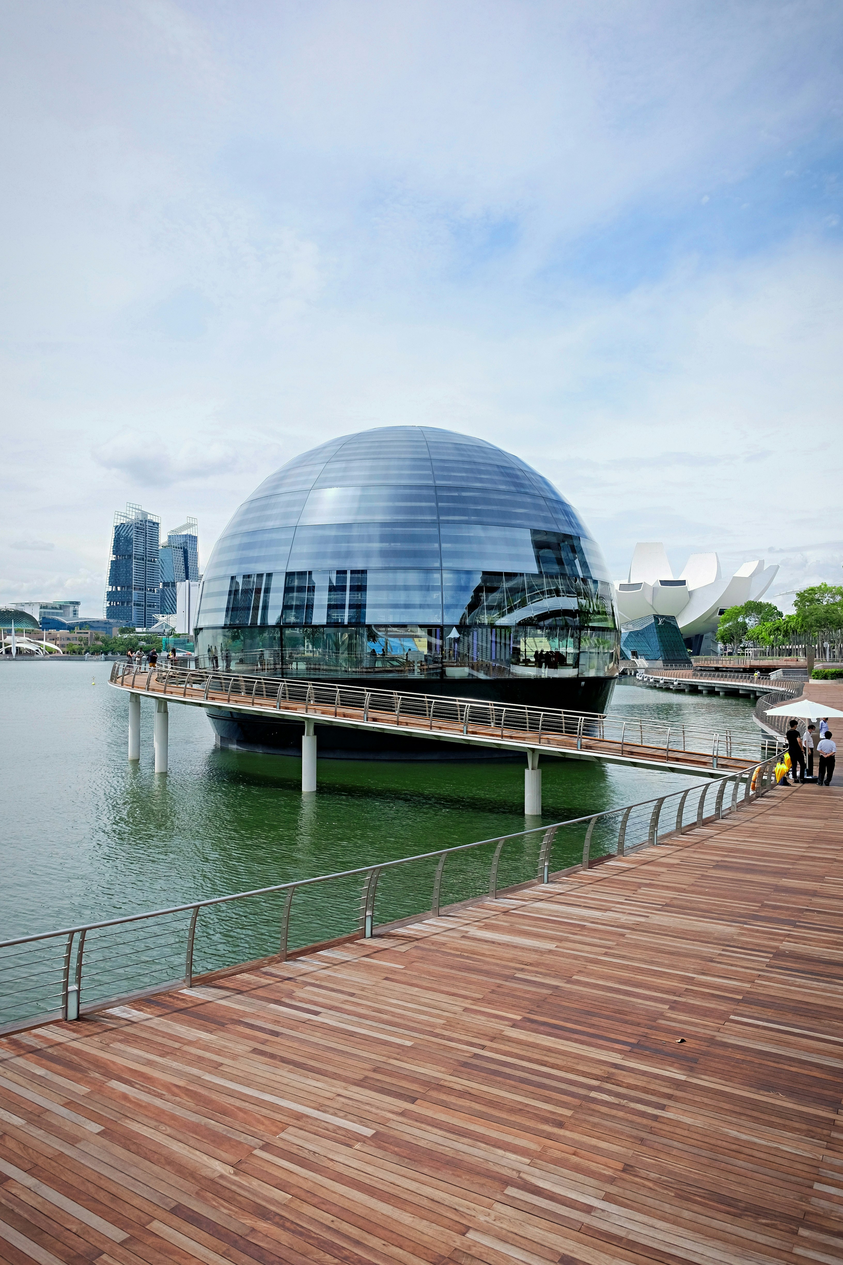 glass building near body of water during daytime